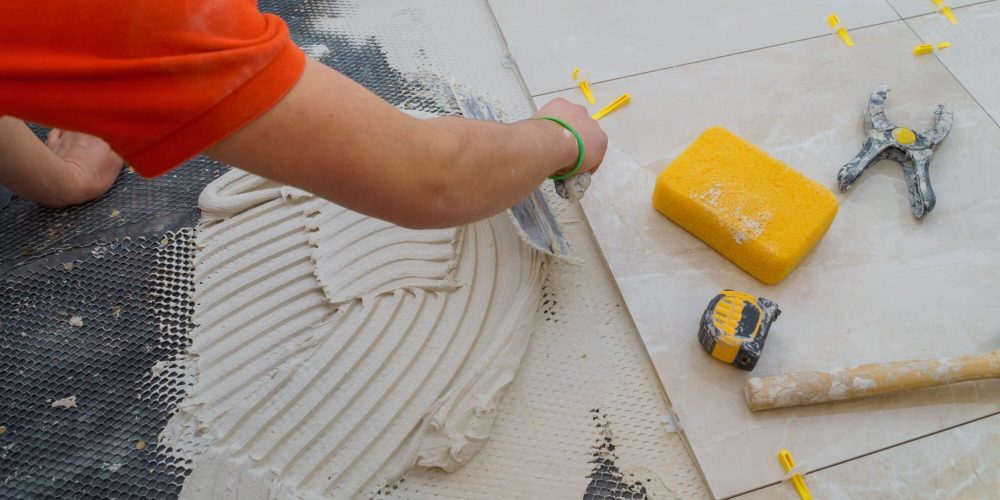 applying-new-tiles-on-bathroom-floor-tile-installa-2026-01-09-08-59-11-utc